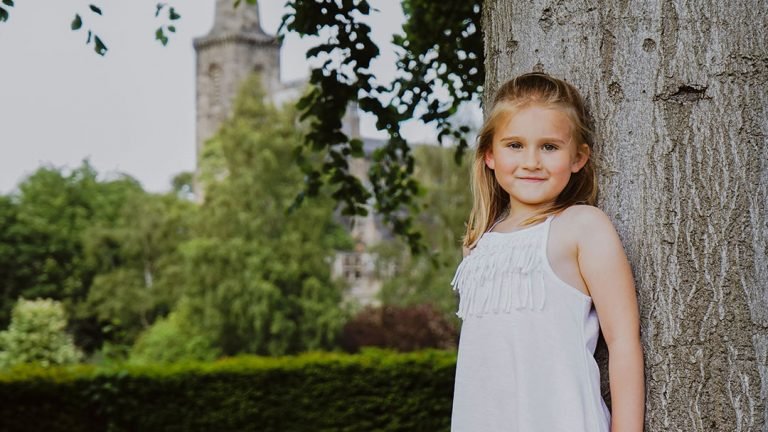 Girl against tree Pittencrieff park Dunfermline